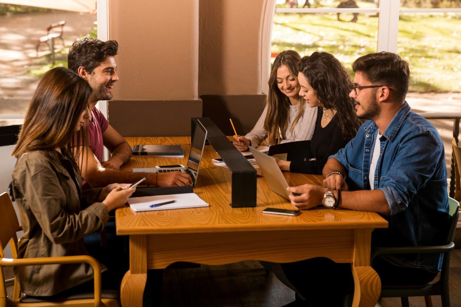 Groups of friends studying together on the bibliotech